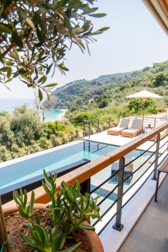 a villa with a pool and a view at Aquanera Villas - Sunrise View Retreat with Private Pool- 5 minutes from the beach- By Villa Mana Gers in Agii Saranta