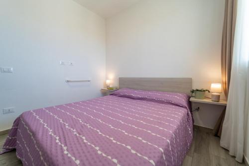 En eller flere senge i et værelse på GuestHost - Borgo 84 Marzamemi - Hermes Apartment