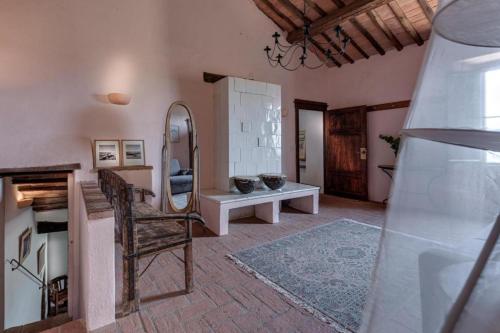a living room with a mirror and a table at Country House Art and Garden in Monte Antico