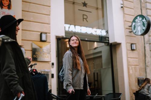 a woman standing in front of a store at Melior Boutique Hotel in Valletta