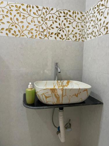 a sink on a shelf in a bathroom at Amaani Villa in Lonavala