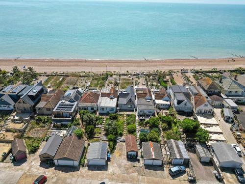 an aerial view of houses and the beach at Seashells-Stylish Coastal Living in Pevensey