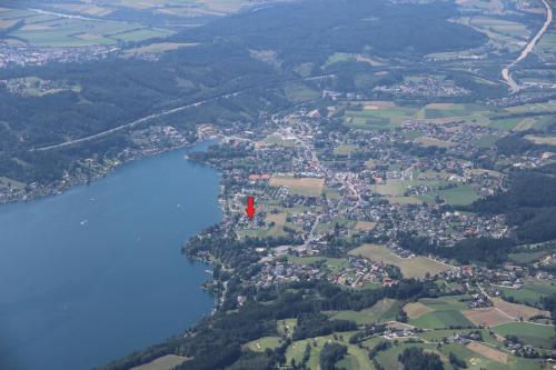 arial view of a lake with a red flag on it at Seeappartements Bacher in Seeboden