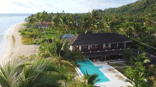 an aerial view of a house on the beach at Yapak Beach Villas in San Isidro