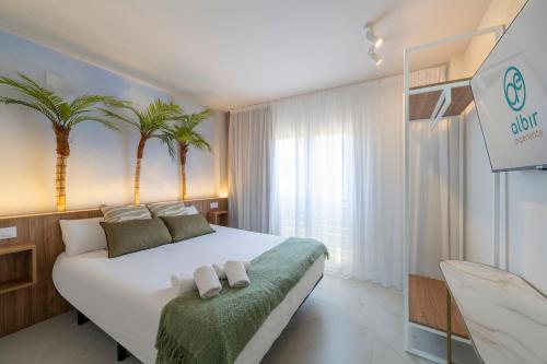 Ένα ή περισσότερα κρεβάτια σε δωμάτιο στο Albir Experience