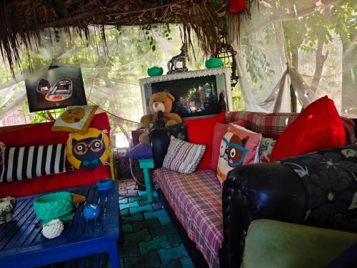 a living room with a couch and a teddy bear at Side Tuana Garden Home in Side
