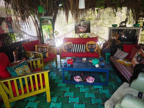 a living room with couches and chairs and a table at Side Tuana Garden Home in Side