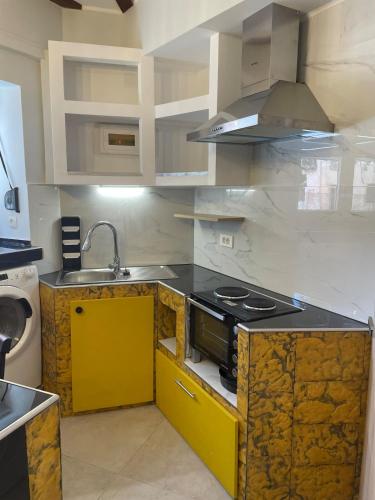a kitchen with a stove and a sink in it at Ionian Nest in Kríni