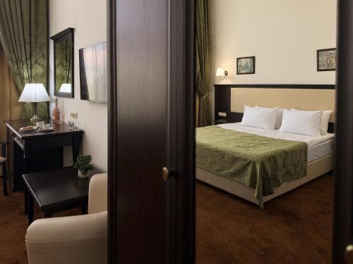 Кровать или кровати в номере Stadium Park Hotel
