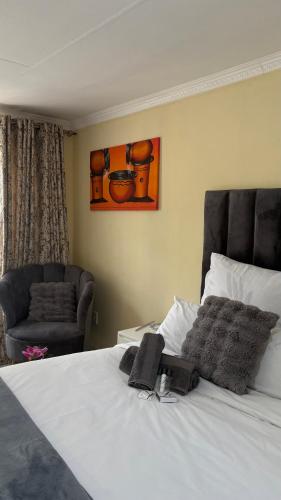 Ένα ή περισσότερα κρεβάτια σε δωμάτιο στο Vuyani Guest Lodge