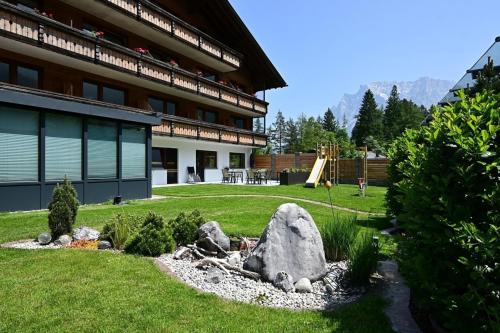 a rock garden in front of a building at Wannig in Biberwier