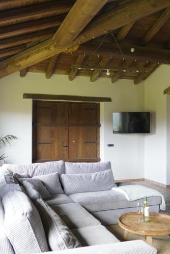 a living room with a couch and a table at Holiday appartment Casa del Cervo in Sestola