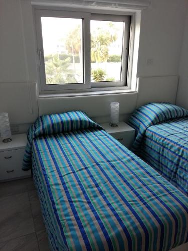 Ένα ή περισσότερα κρεβάτια σε δωμάτιο στο Christopher's Sandy Beach Suites