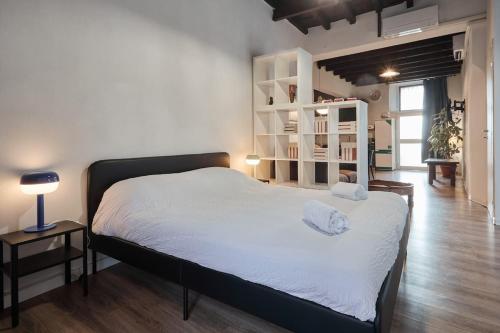 Postel nebo postele na pokoji v ubytování Il Loft nella corte