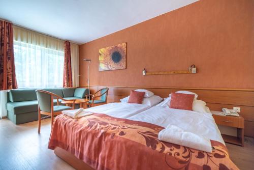 Postel nebo postele na pokoji v ubytování Hotel Panoráma
