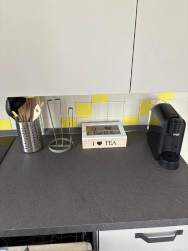 a kitchen counter with a box on top of it at Marghera Central House in Venice