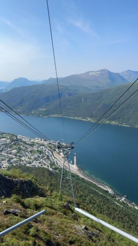 a view of a body of water and a mountain at Bispen Villa Utsikten in Åndalsnes