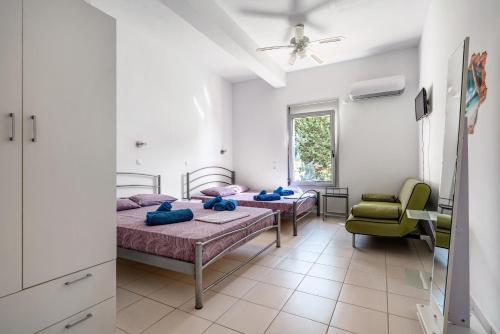 Postel nebo postele na pokoji v ubytování Villa Skorpios