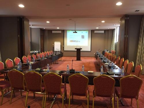 a meeting room with a long table and chairs at Ngong Hills Hotel in Nairobi