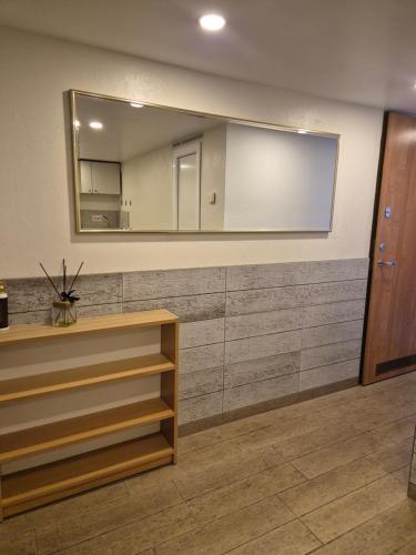 a large mirror on a wall in a room at Palanga S3 in Palanga