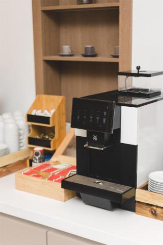 a microwave sitting on top of a counter at Radisson Resort Ruza Vjetrova in Dobra Voda
