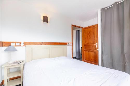 Ein Bett oder Betten in einem Zimmer der Unterkunft Les Aiguilles De Warens