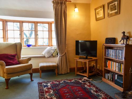 Televiisor ja/või meelelahutuskeskus majutusasutuses Seagate Cottage