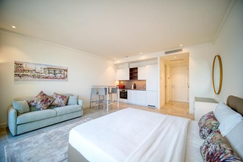 a living room with a bed and a couch at Lustica Bay Marina Village by 2BHome in Lustica