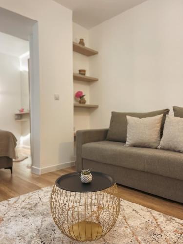 a living room with a couch and a table at Casa Nita in Ulcinj