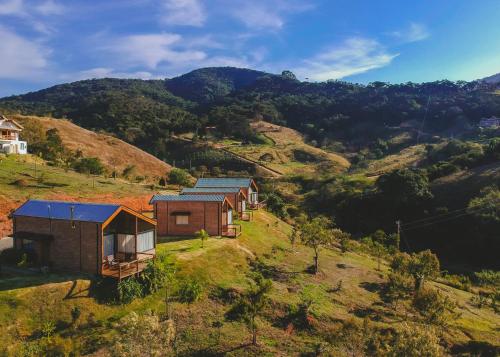 an aerial view of a house on a hill at Pousada Ho'oponopono Chalets & Wine in Sapucaí-Mirim