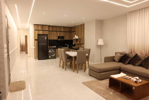 a living room with a couch and a table at White House furnished appartments for rent in 6th Of October