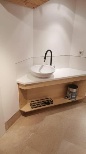 a bathroom with a white sink on a counter at Alte Schmiede in Oldenburg