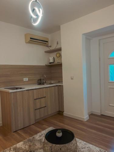 a kitchen with a sink and a counter top at Casa Nita in Ulcinj
