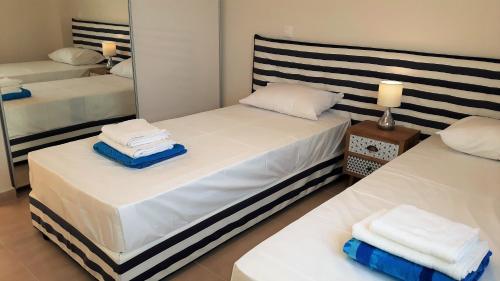 Säng eller sängar i ett rum på Villa Thalassa