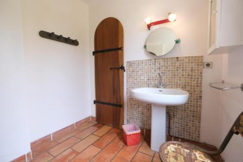 a bathroom with a sink and a mirror at magnificent detached villa with heated swimming pool and jacuzzi, in aureille, in the alpilles – 8 people in Aureille