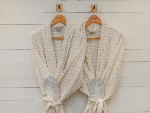 a white sweater hanging on a wall at Retreat - Uk48163 in Battle