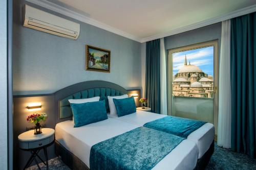 a hotel room with a bed and a window at Tilia Hotel in Istanbul