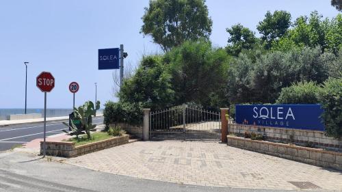 a sign for a sala a village on the side of a road at Solea Village sul mare in San Sostene Marina