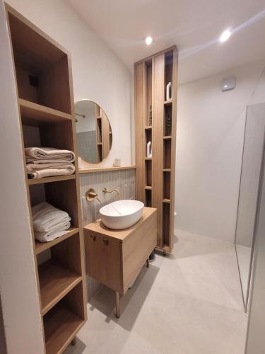 a bathroom with a sink and a shower at 3PAPIGE Apartment in Piran