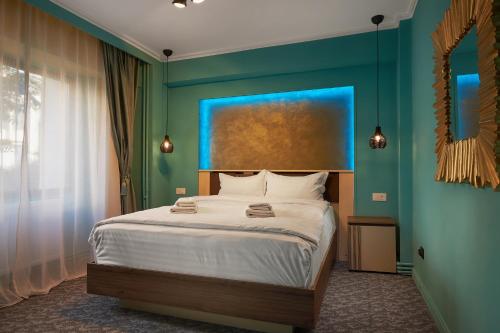 En eller flere senge i et værelse på Lapusneanu Central Apartments