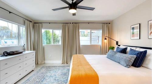 a bedroom with a bed and a ceiling fan at Brilliance-Fire Pit & Foosball-Middle of Old Town in Scottsdale