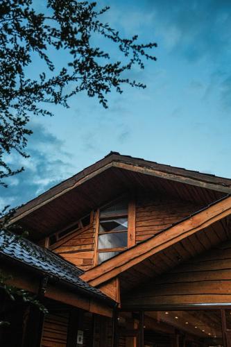 a roof of a house with a window on it at Alto Melimoyu Hotel & Patagonia in La Junta