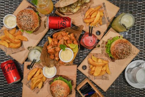 a table topped with different types of fast food at Alto Melimoyu Hotel & Patagonia in La Junta