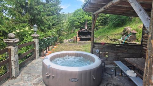 a large tub of water on a patio at VilaBellavistasmjestaj in Vlasic