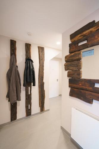 a room with several pieces of wood on the wall at Ferienwohnung Hummel in Gammertingen