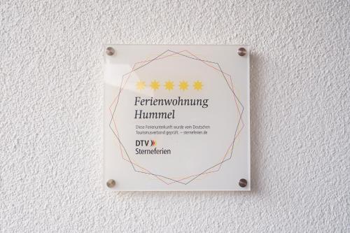 a sign on a wall with stars on it at Ferienwohnung Hummel in Gammertingen