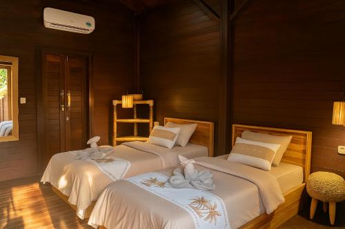 Postel nebo postele na pokoji v ubytování Casa22 Gili Trawangan