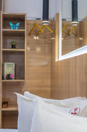 a bedroom with a white bed and a mirror at W hotel in Dakhla