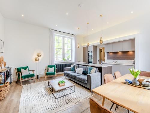 a living room with a couch and a table at Upstairs - Uk43928 in Clitheroe