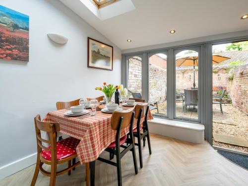 a dining room with a table and chairs at Fantastic 3-bed home close to Shrewsbury centre - Pass the Keys in Shrewsbury